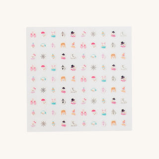 Sheet of Christmas nail art stickers with various designs on a white background