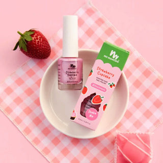 Bottle of naturally scented peel off nail polish in pastel pink labeled as the best nail polish for toddlers, safe and non-toxic