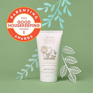 Tube of Dabble Ducky baby lotion with Good Housekeeping Award badge on green background
