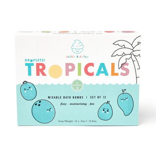A collection of colorful mini bath bombs with different fruit scents, displayed alongside their packaging which is also shown. The packaging is labeled 'TROPICALS' and has tropical-themed illustrations.