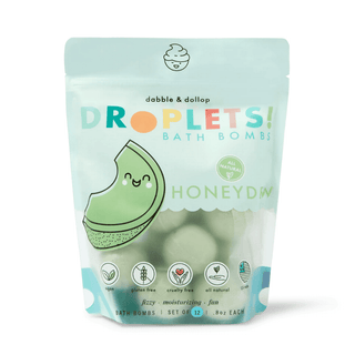 A resealable pouch of Dabble & Dollop's Droplets Bath Bombs, labeled 'Honeydew'. The packaging is transparent, showing the green bath bombs inside, and includes the brand logo, product name, and additional details such as '100% natural', 'vegan', 'gluten-free', and 'cruelty-free'.