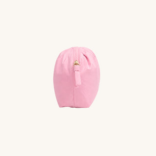Pink puffer accessory bag shown from the side