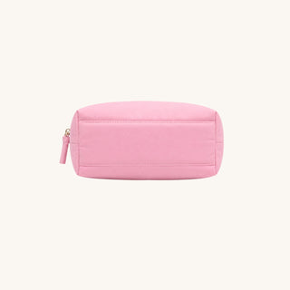 Pink puffer accessory bag showing its flat base