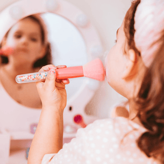 Kids makeup brushes with sprinkles in a 5-piece set, stored in a clear snap case for fun and organized beauty play