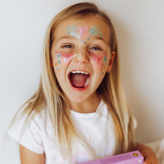 Mermaid glitter kit with three ocean-inspired biodegradable glitter for face shades, natural glue primer, and reusable magnetic-closing box for eco-friendly sparkle