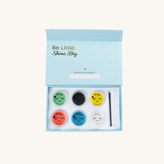 Set of colorful face masks in a box with 'Be Little. Shine Big.' text on a white background