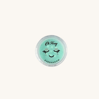 Mint eyeshadow container with a smiley face design on a white background