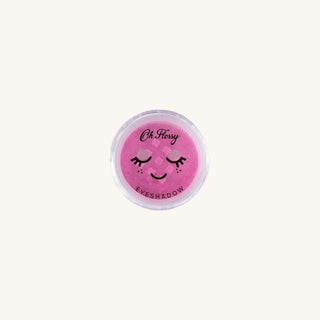 Pink eyeshadow compact with 'Oh Flossy' branding on a white background