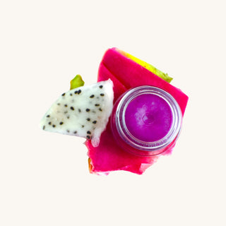 Organic lip gloss for kids in a glass jar with purple dragon fruit tint