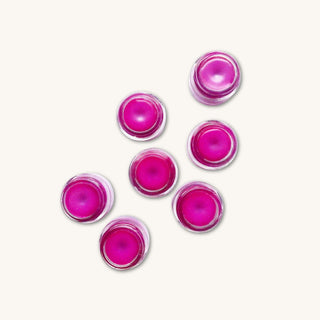 Organic lip gloss for kids in a glass jar with purple dragon fruit tint
