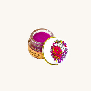 Organic lip gloss for kids in a glass jar with purple dragon fruit tint