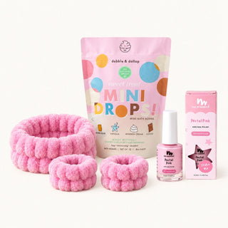 Popsicle Beauty Club Pink Spa Day Set with Sweet Treat mini bath bombs, a pink spa headband and wristbands, and pink nail polish