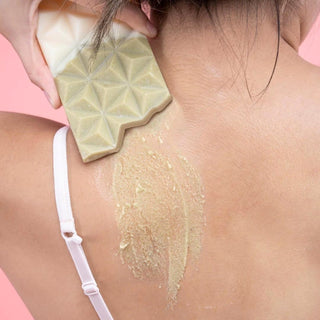 Raw sugar scrub for face and body shaped like a chocolate bar with natural sugar crystals, cocoa butter, and sunflower oil