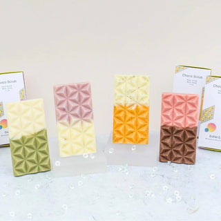 Raw sugar scrub for face and body shaped like a chocolate bar with natural sugar crystals, cocoa butter, and sunflower oil