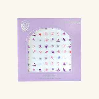 Daydream Society Sugarplum Nail Stickers in lavender packaging with an arched window showing pastel holiday designs.